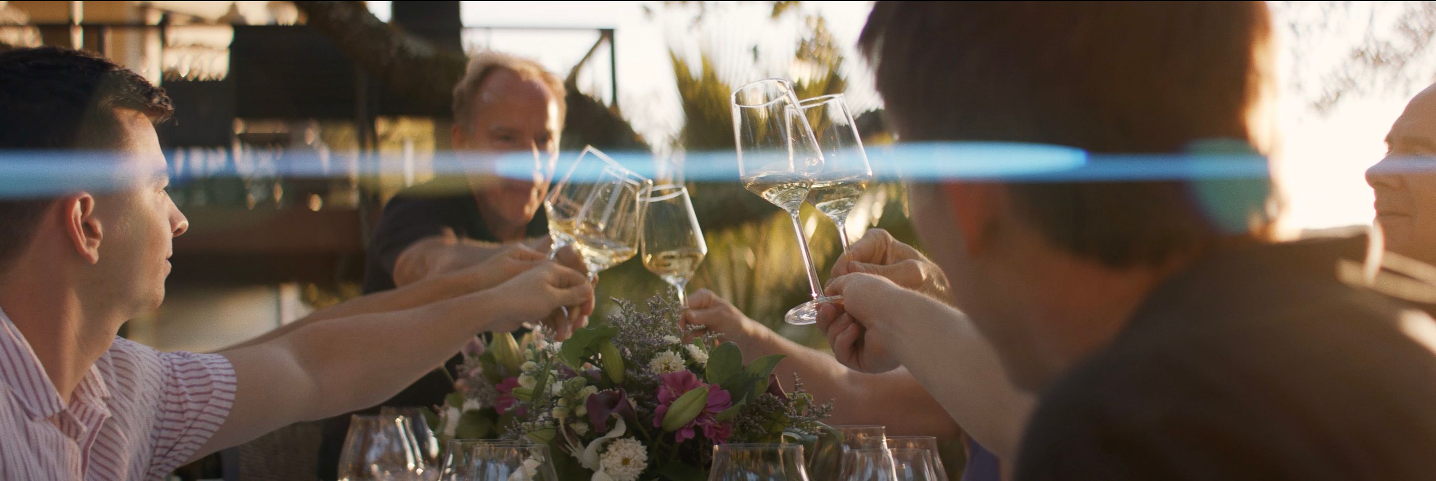 A toast with glasses of Domaine Della Chardonnay