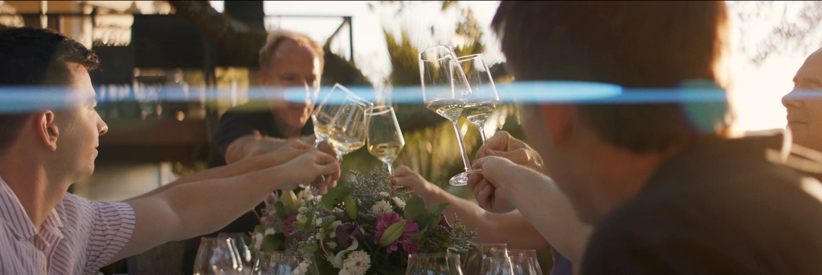 A toast with glasses of Domaine Della Chardonnay